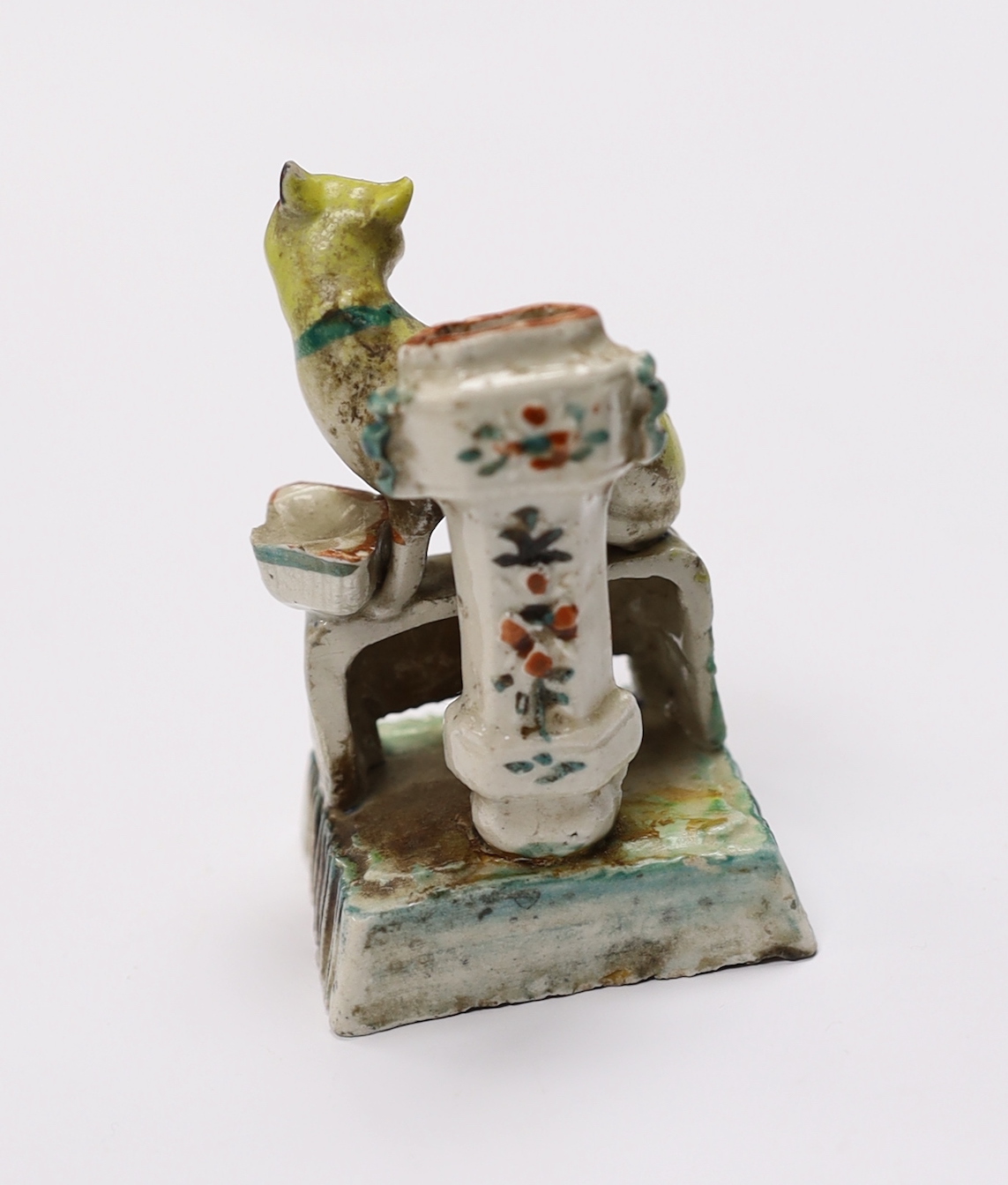 An 18th century Chinese enamelled blanc de chine 'cat' joss stick holder, 7cm